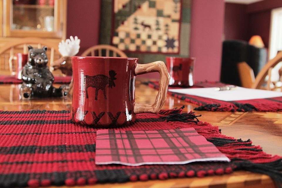 A mug sitting on a decorative placemat